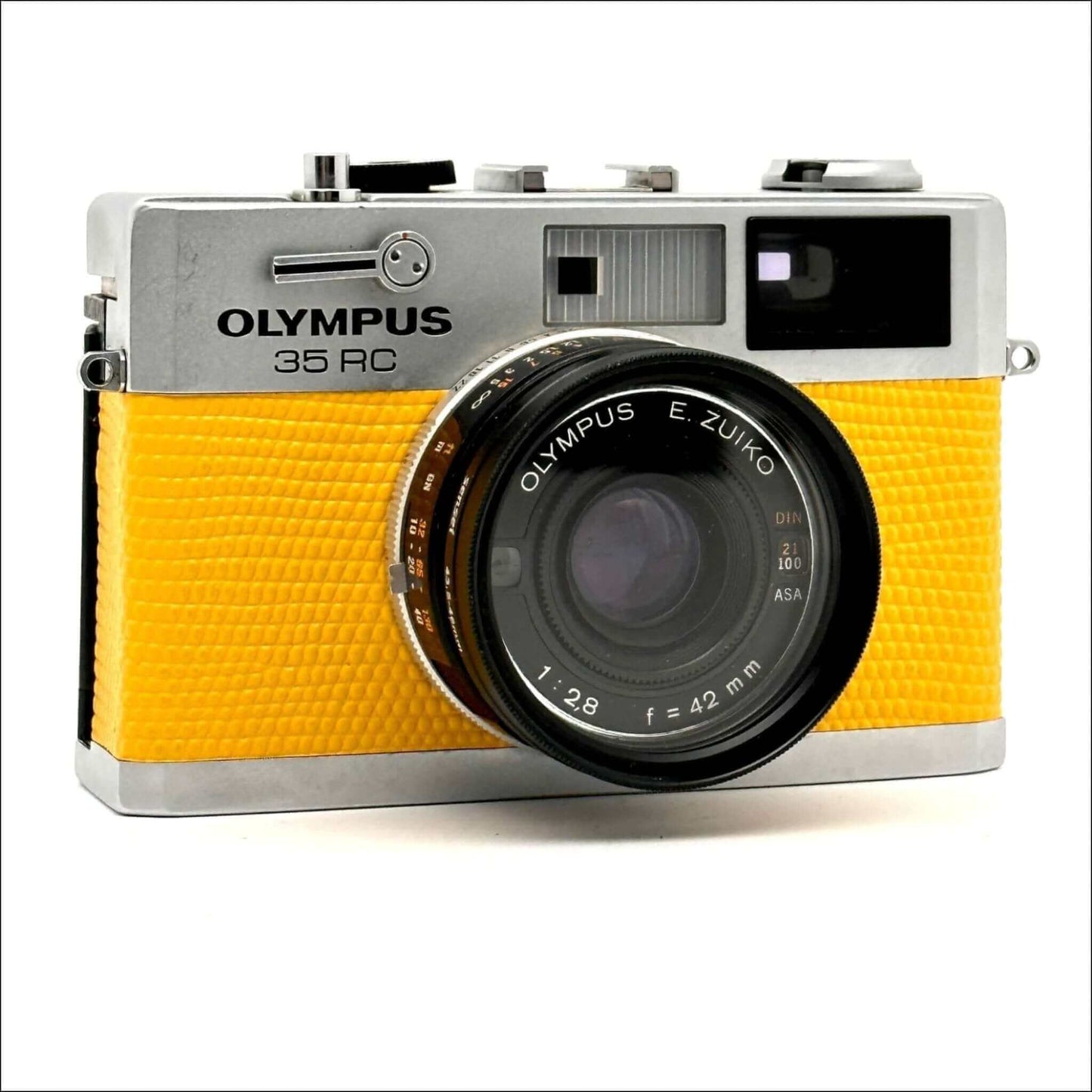 Vintage Olympus 35 RC film camera with yellow leather cover and Zuiko 42mm f/2.8 lens.