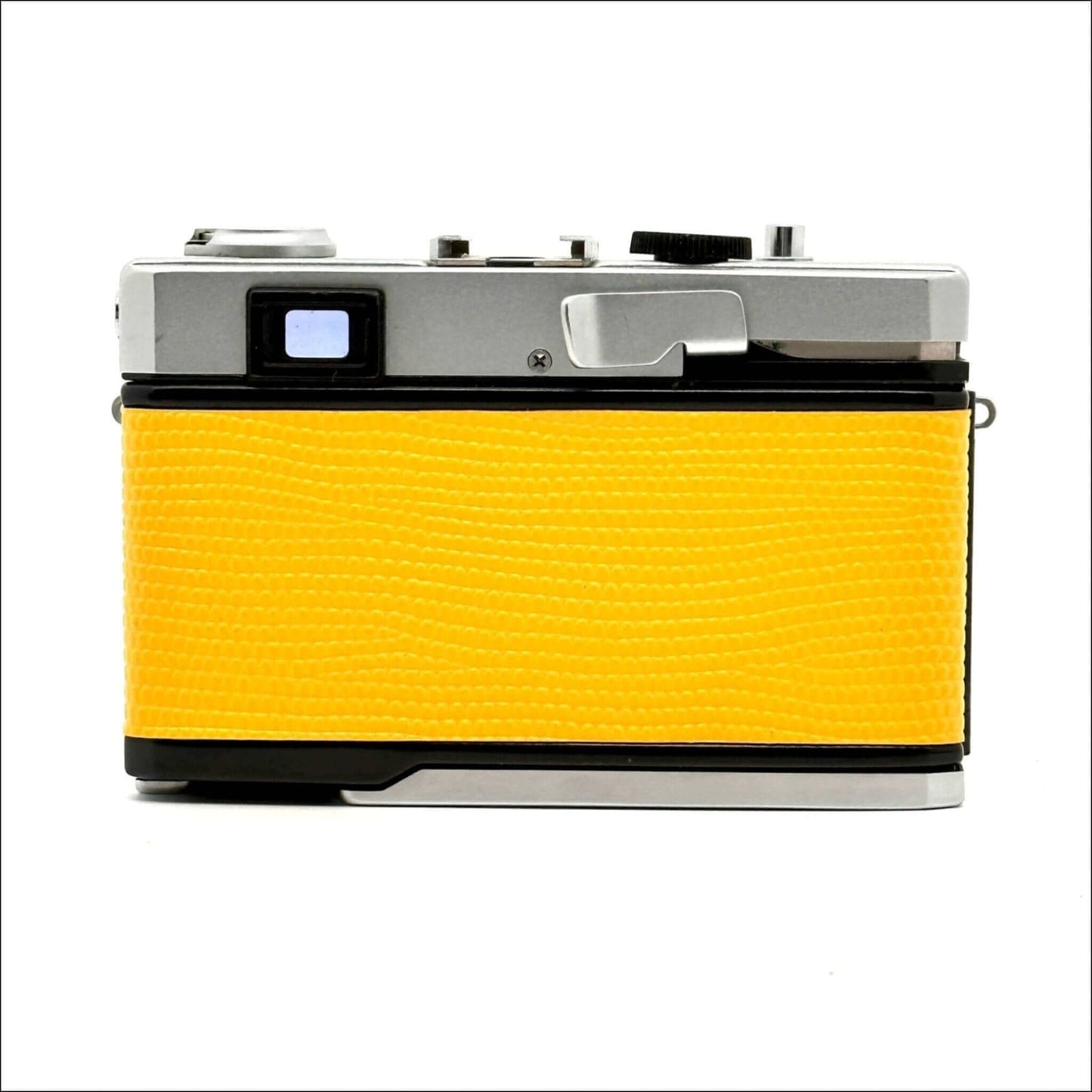 Vintage film camera with textured yellow leatherback.