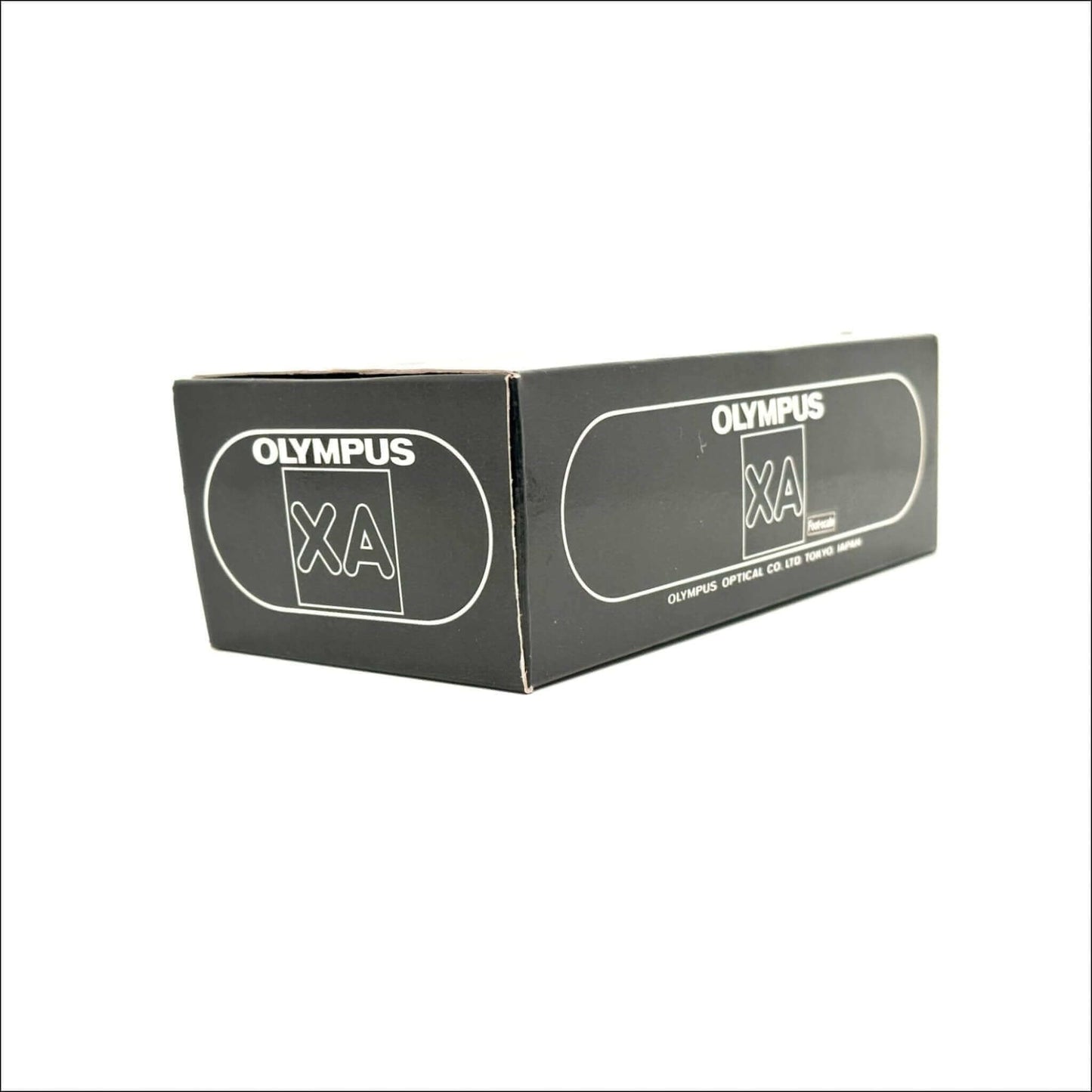 Olympus XA vintage 35mm film camera box showing branding and design details.
