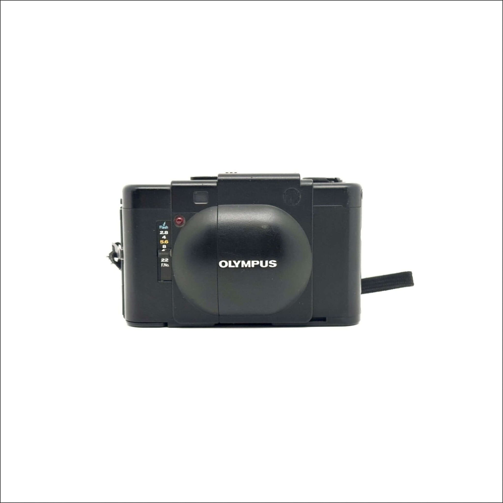 Vintage Olympus film camera with protective casing in black color against white background.