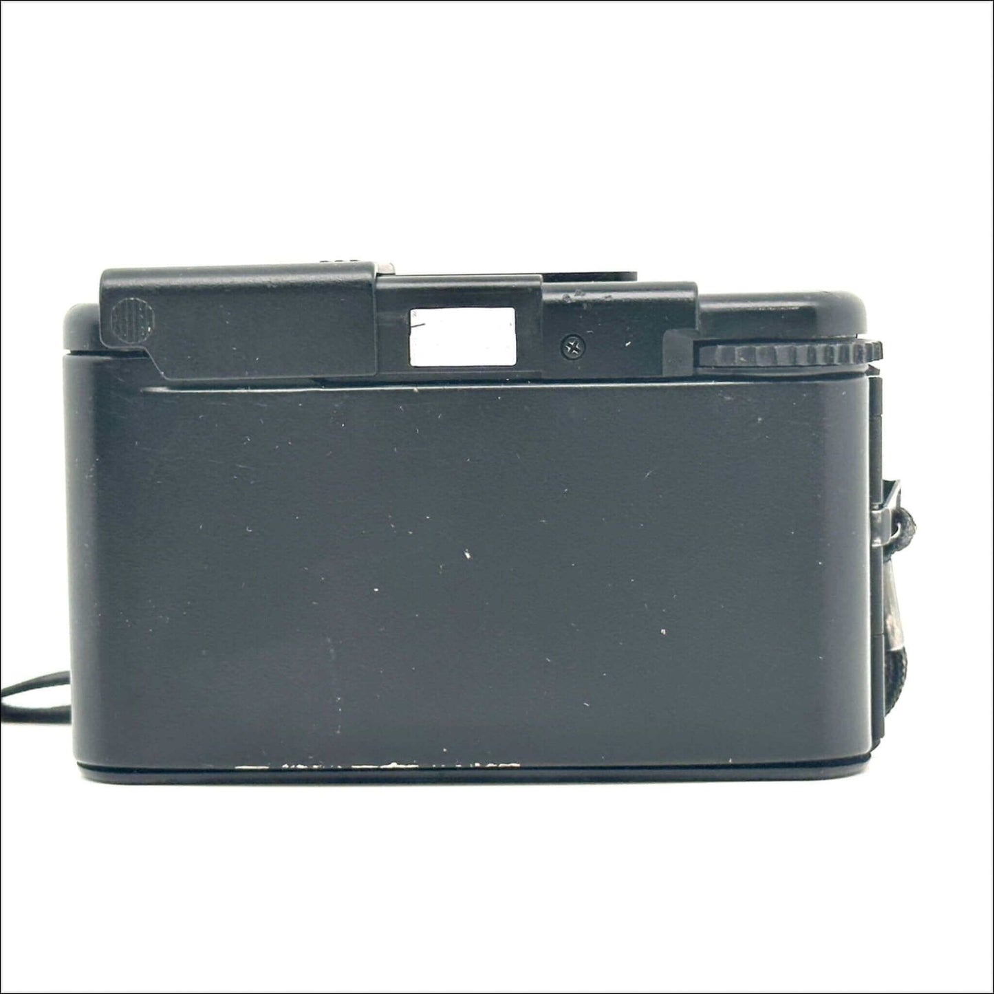 Vintage black compact camera viewed from the rear.