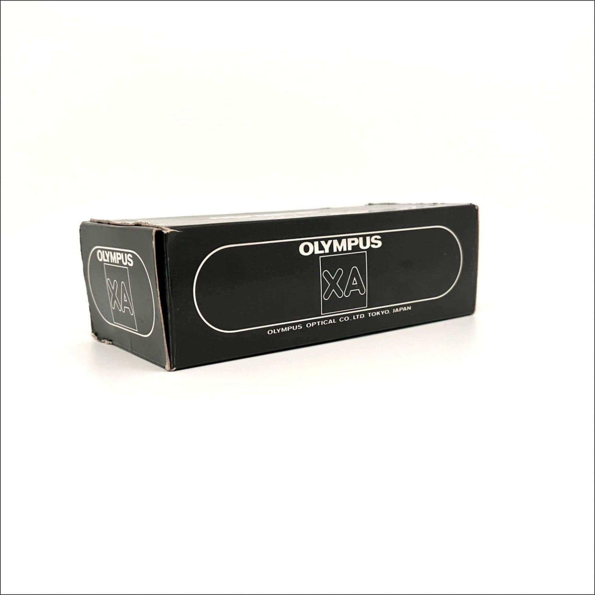 Olympus XA film camera box, vintage design, black packaging showcasing Olympus logo.