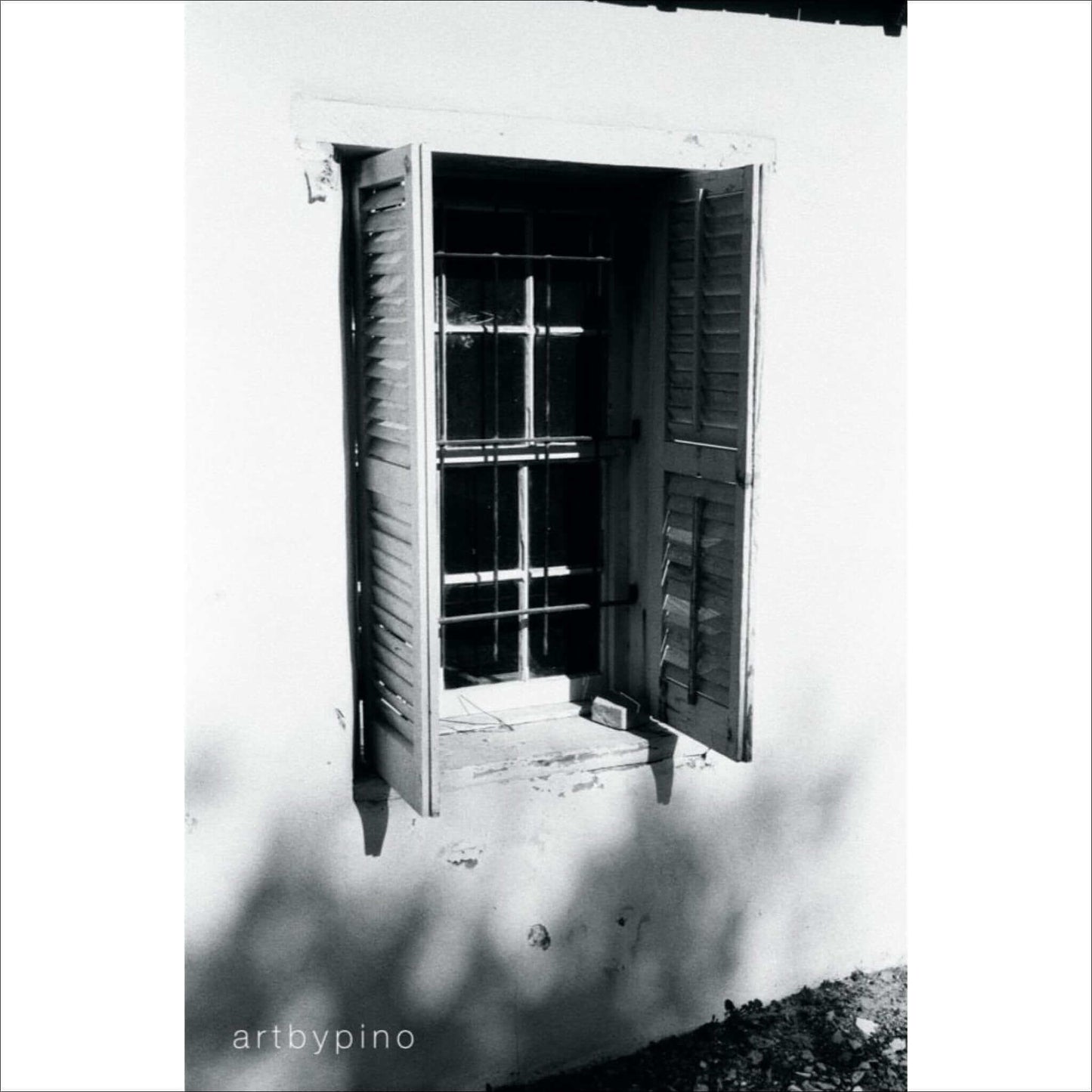 Black and white photo of an open window with shutters by artbypino.